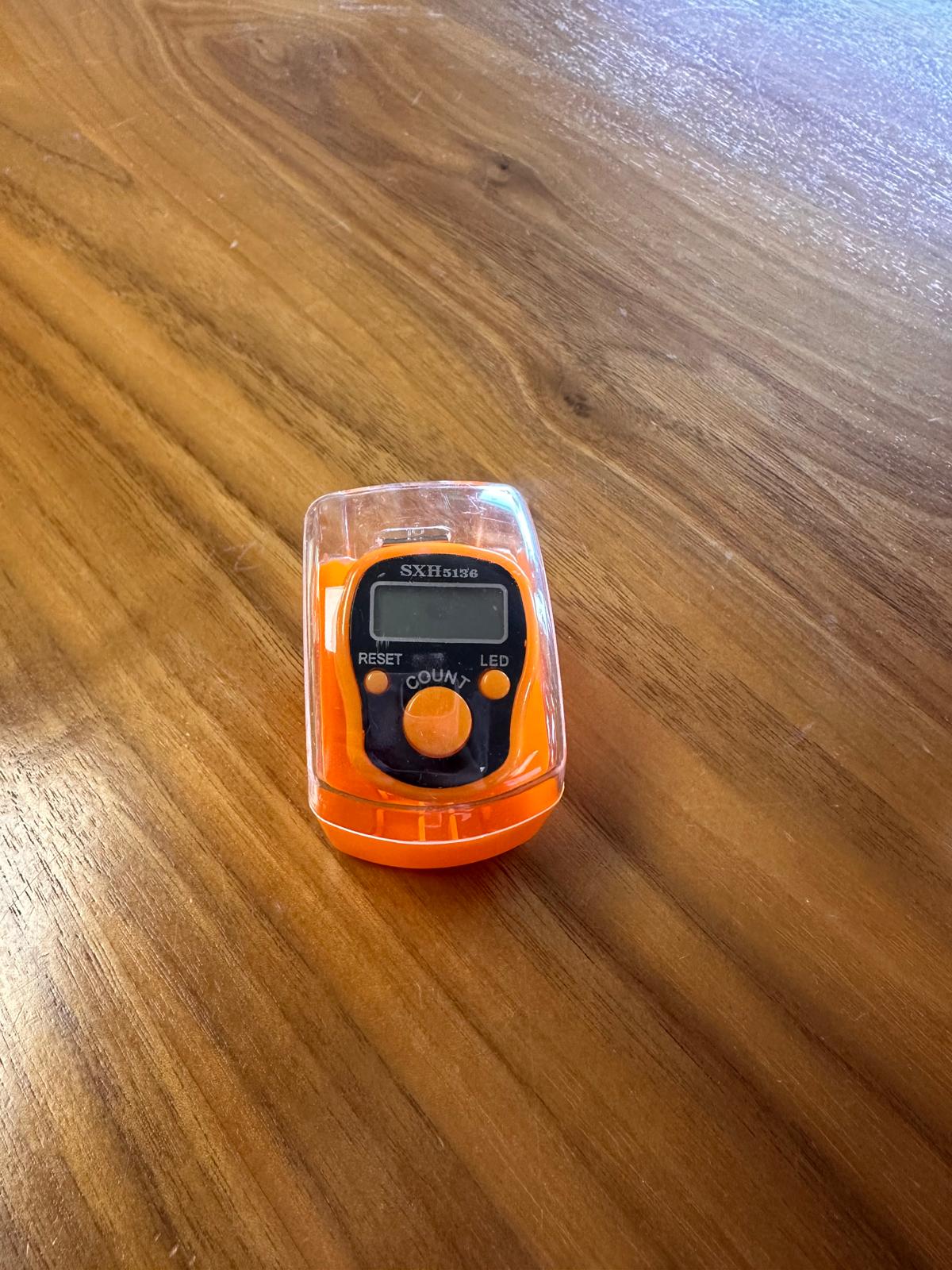 Orange LED light dhikr clicker in case