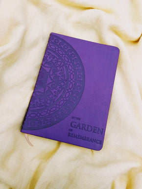 book In the Garden of Remembrance placed on a silk cloth